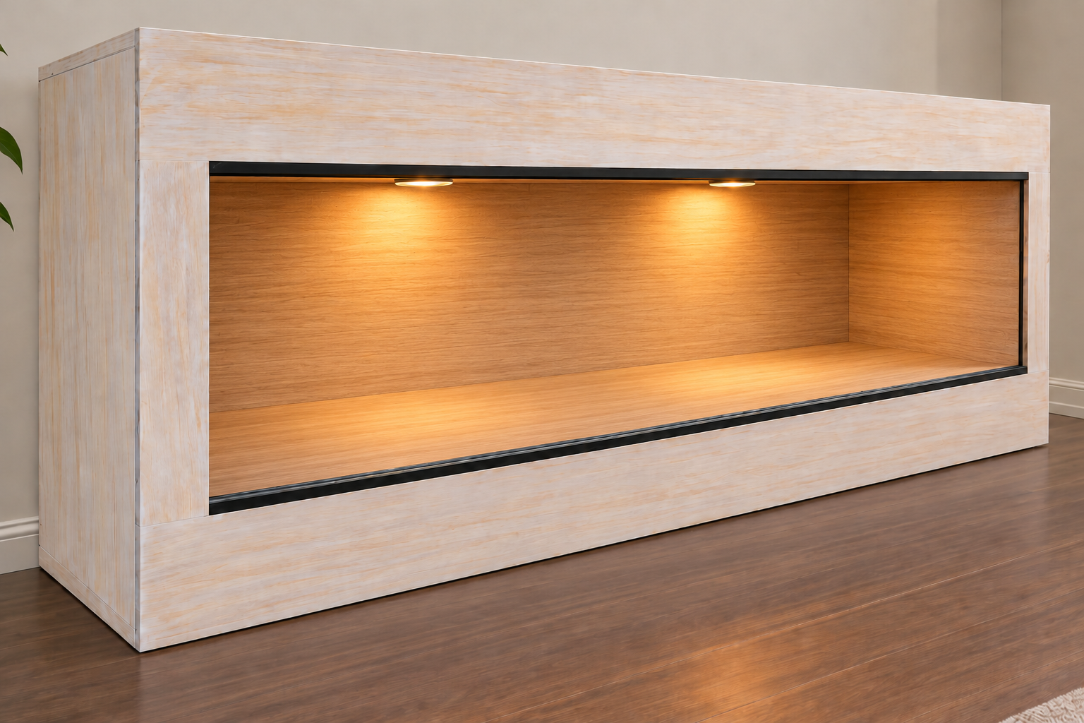 Whitewashed wood panoramic reptile enclosure with matte black glass tracks and warm recessed interior lighting in a room with wood flooring